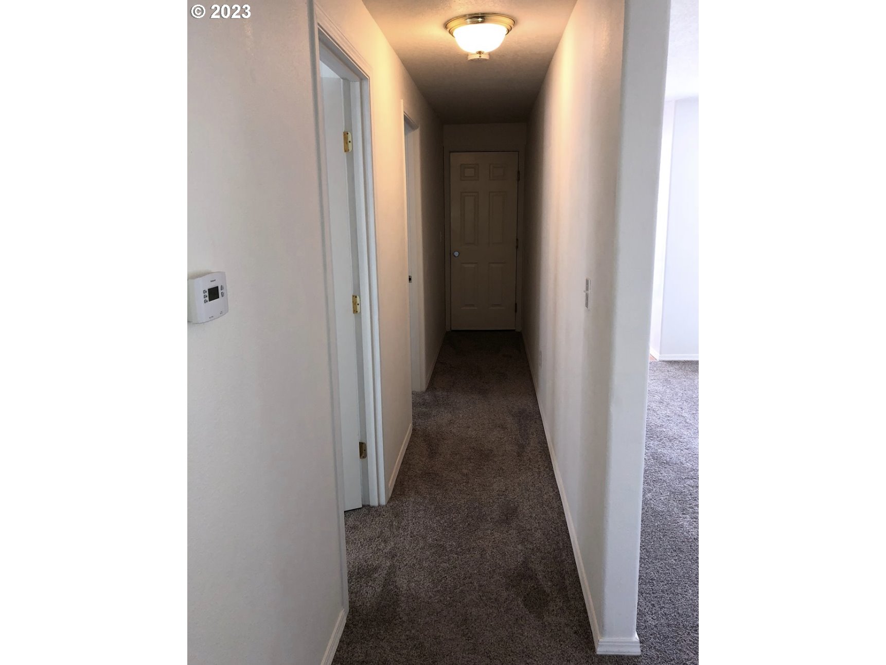 1001 Southwest Nye Avenue Pendleton, OR 97801 - Photo 13 of 14 a view of a hallway with a white door