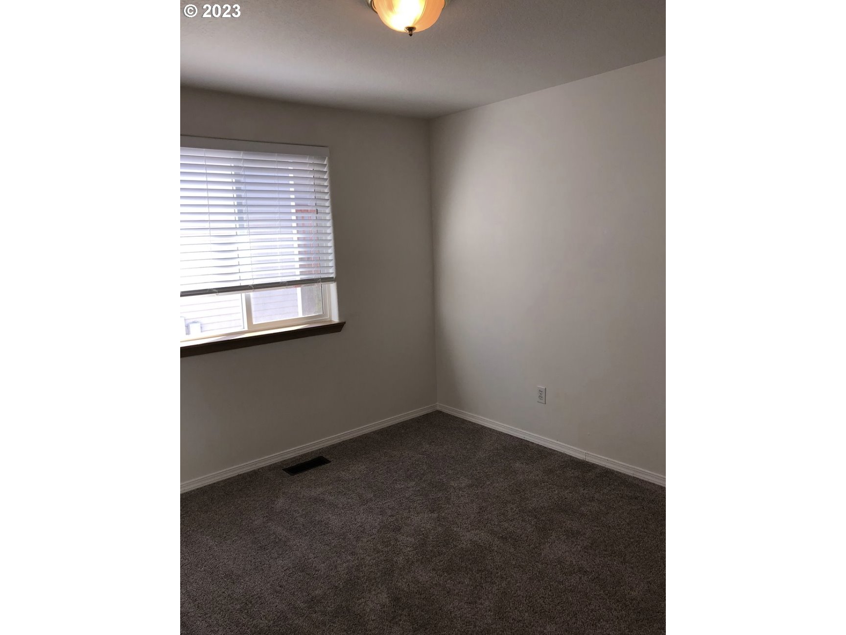 1001 Southwest Nye Avenue Pendleton, OR 97801 - Photo 14 of 14 a view of an empty room with a window
