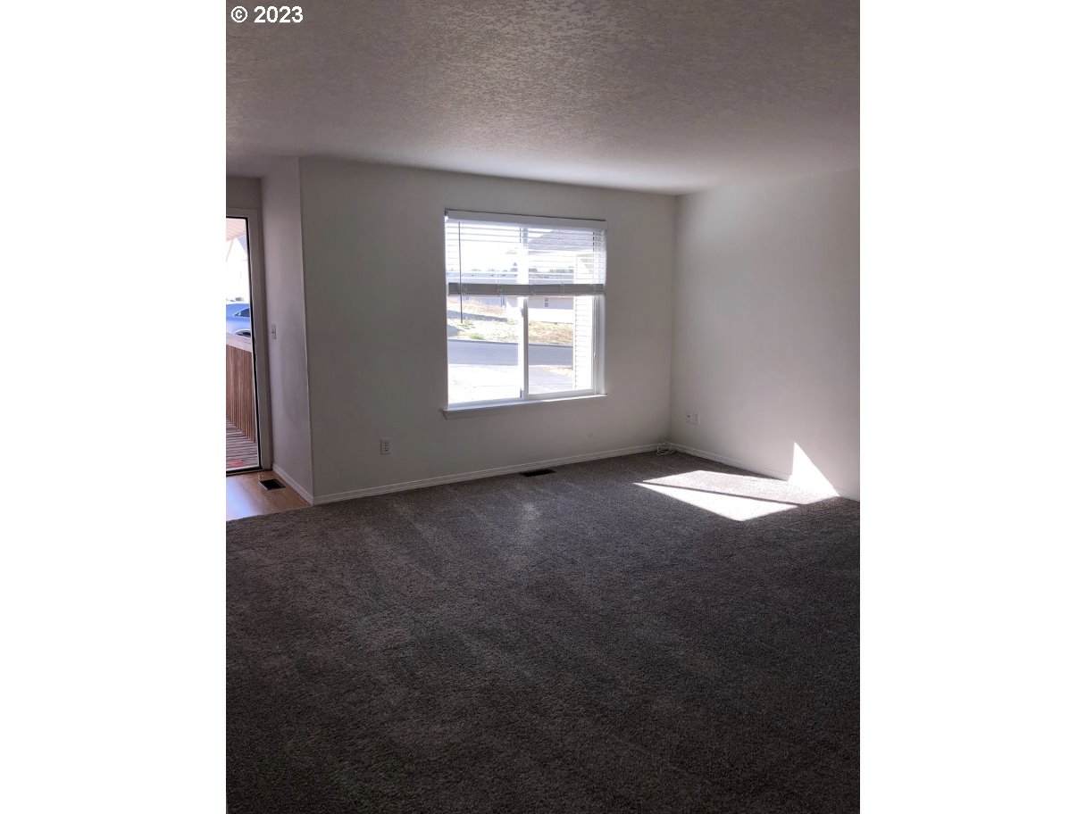 1001 Southwest Nye Avenue Pendleton, OR 97801 - Photo 5 of 14 a view of an empty room with a window