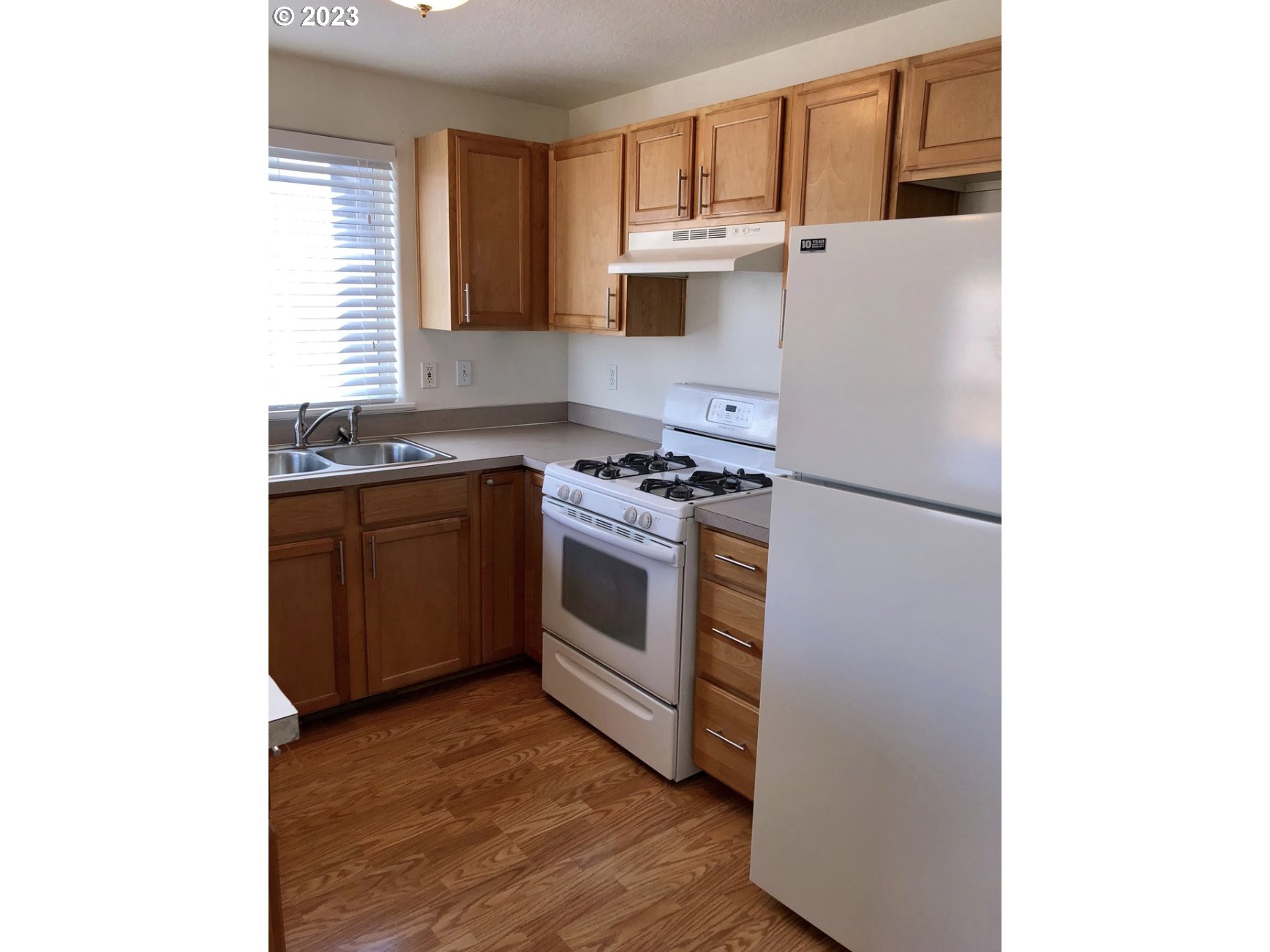 1001 Southwest Nye Avenue Pendleton, OR 97801 - Photo 6 of 14 a kitchen with stainless steel appliances granite countertop a stove a sink and a refrigerator