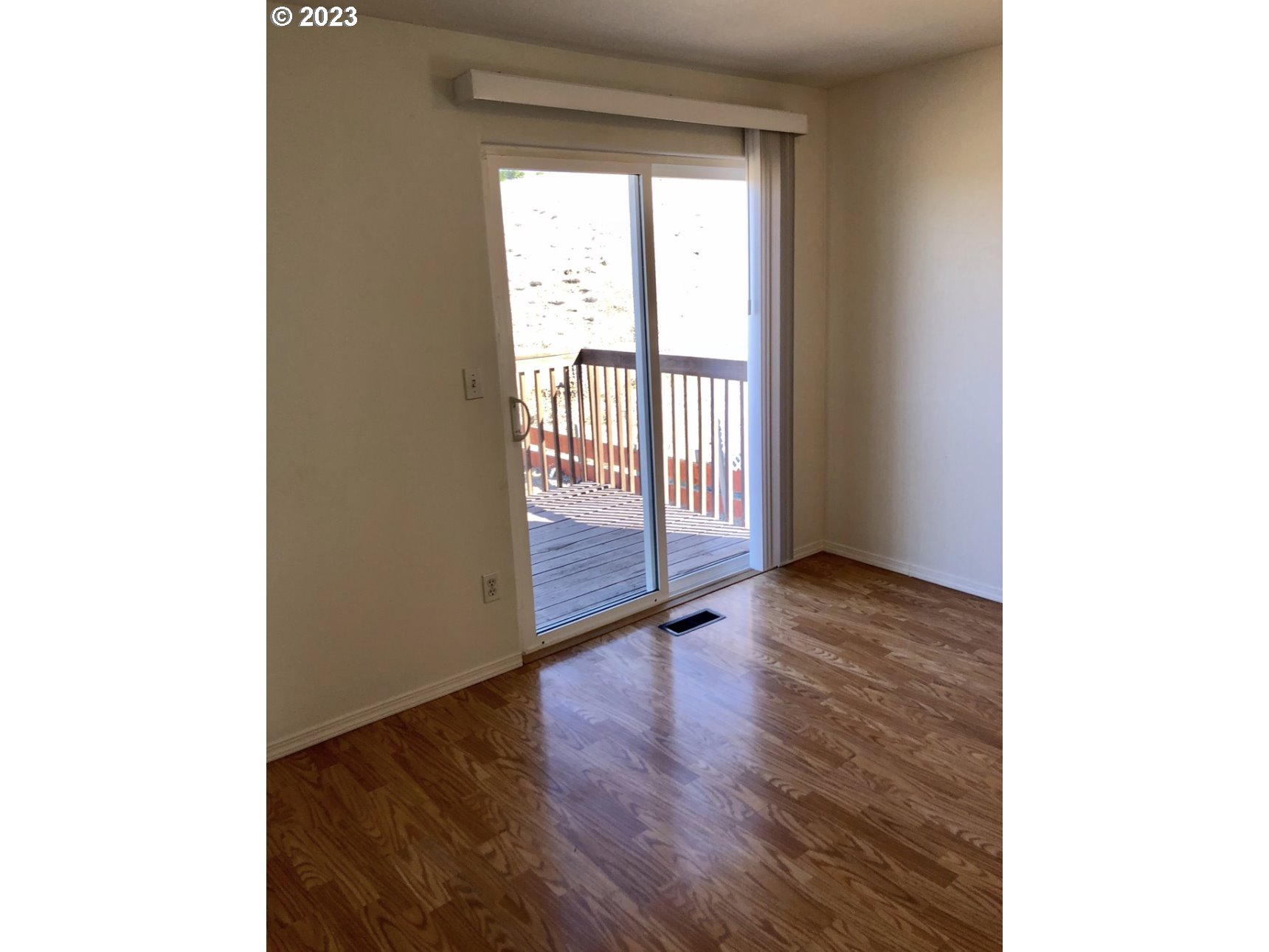 1001 Southwest Nye Avenue Pendleton, OR 97801 - Photo 7 of 14 a view of an empty room with wooden floor