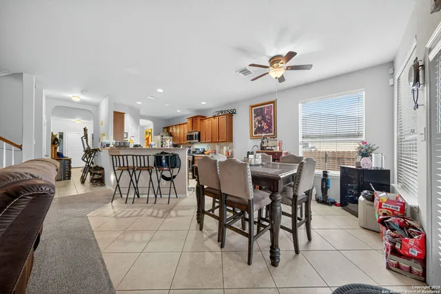 a living room with furniture and a table
