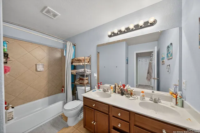 a bed room with furniture and a flat screen tv