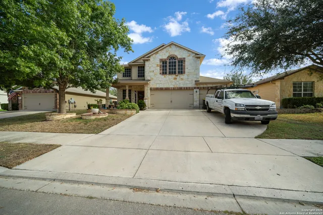 a front view of a building with potted plants
