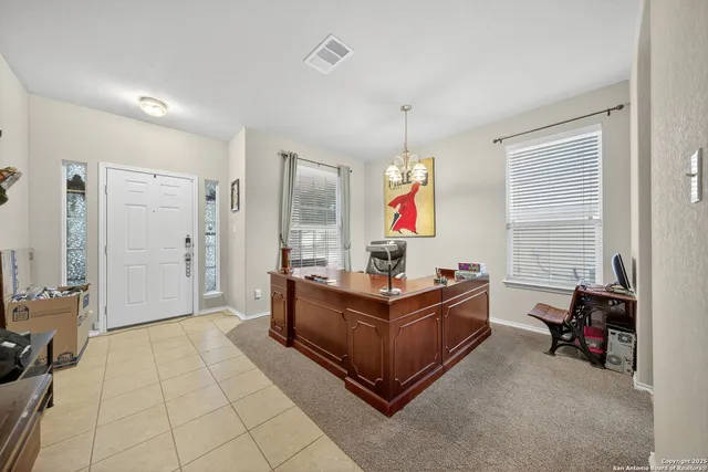 a living room with furniture a dining table and chairs with kitchen view
