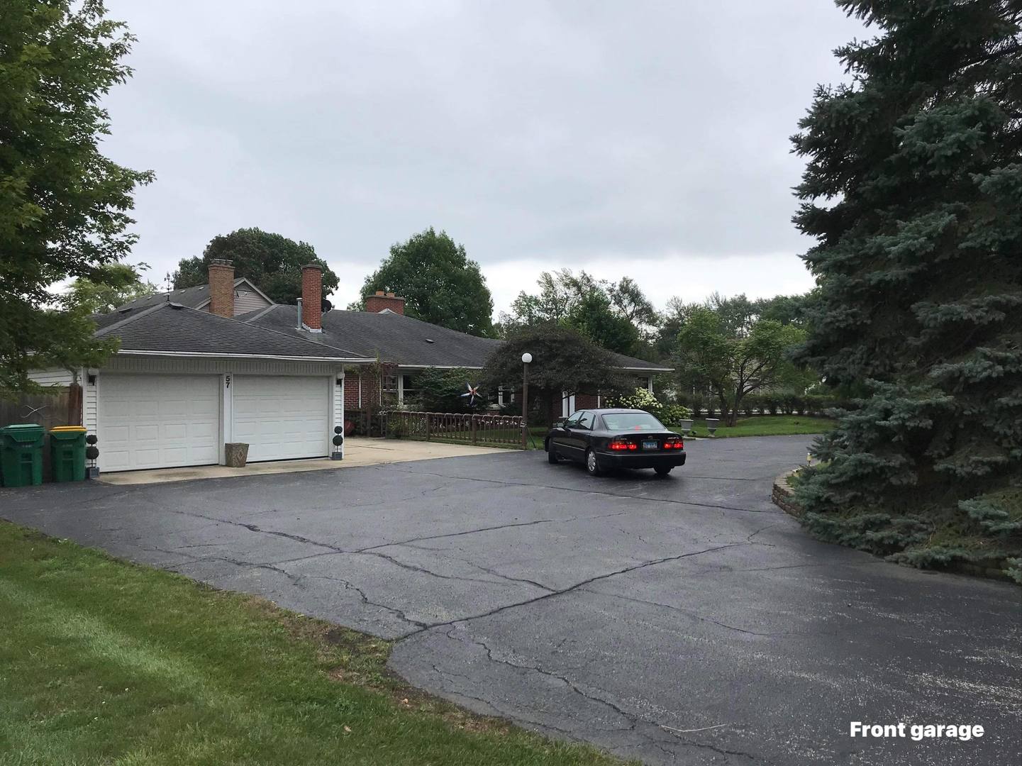 57 South Wolf Road Wheeling, IL 60090 - Photo 5 of 31 a car parked in front of house