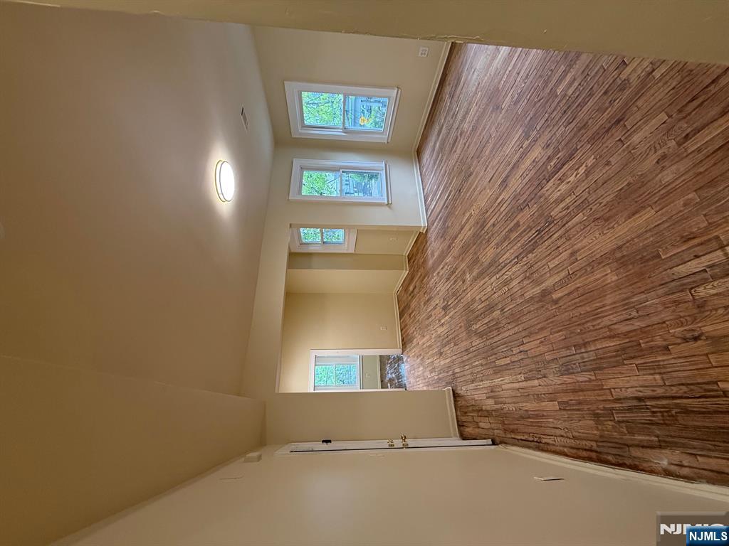 149-151 Scheerer Avenue, Unit 2 Newark, NJ 07112 - Photo 11 of 11 a view of empty room with window and wooden floor