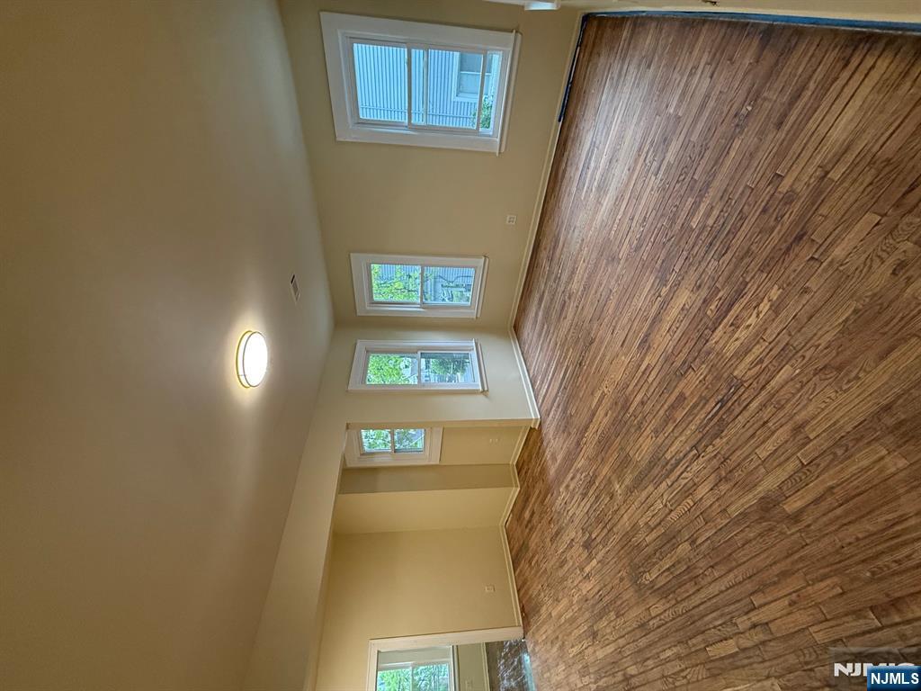 149-151 Scheerer Avenue, Unit 2 Newark, NJ 07112 - Photo 3 of 11 a view of empty room with window and wooden floor