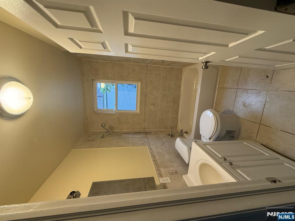 149-151 Scheerer Avenue, Unit 2 Newark, NJ 07112 - Photo 5 of 11 a bathroom with a sink a bathtub and toilet