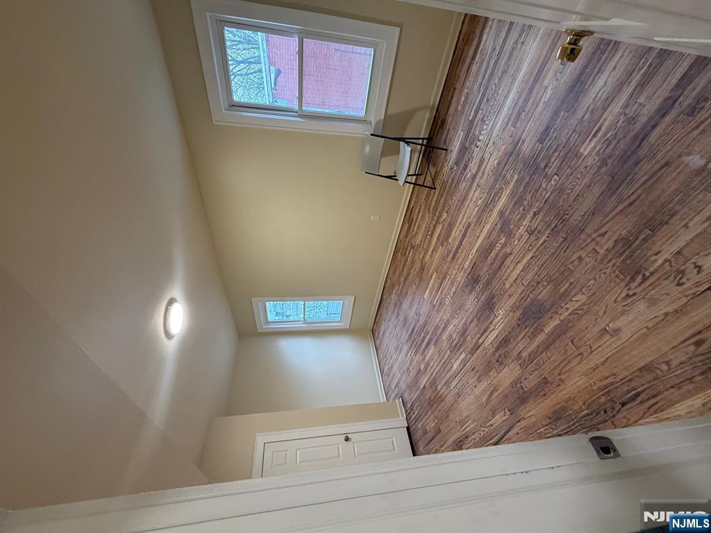 149-151 Scheerer Avenue, Unit 2 Newark, NJ 07112 - Photo 9 of 11 a view of a room with wooden floor and window