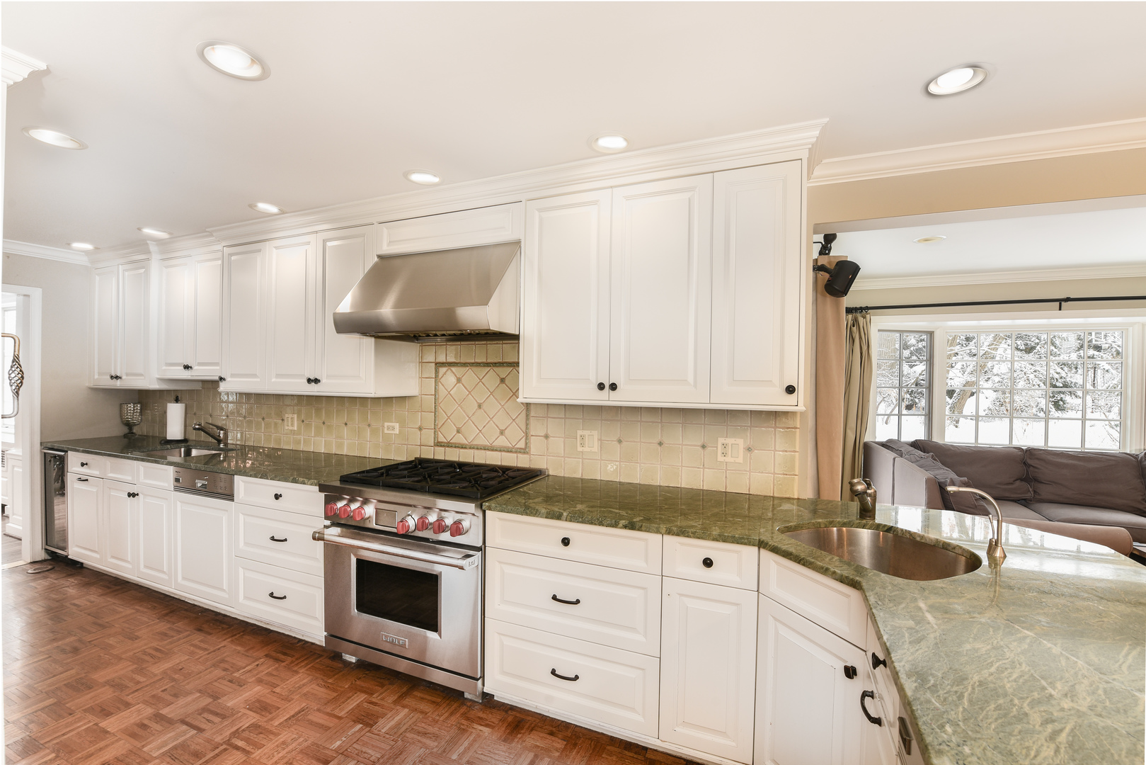 710 Walden Road Winnetka, IL 60093 - Photo 12 of 28 a kitchen with stainless steel appliances granite countertop a stove a sink and white cabinets