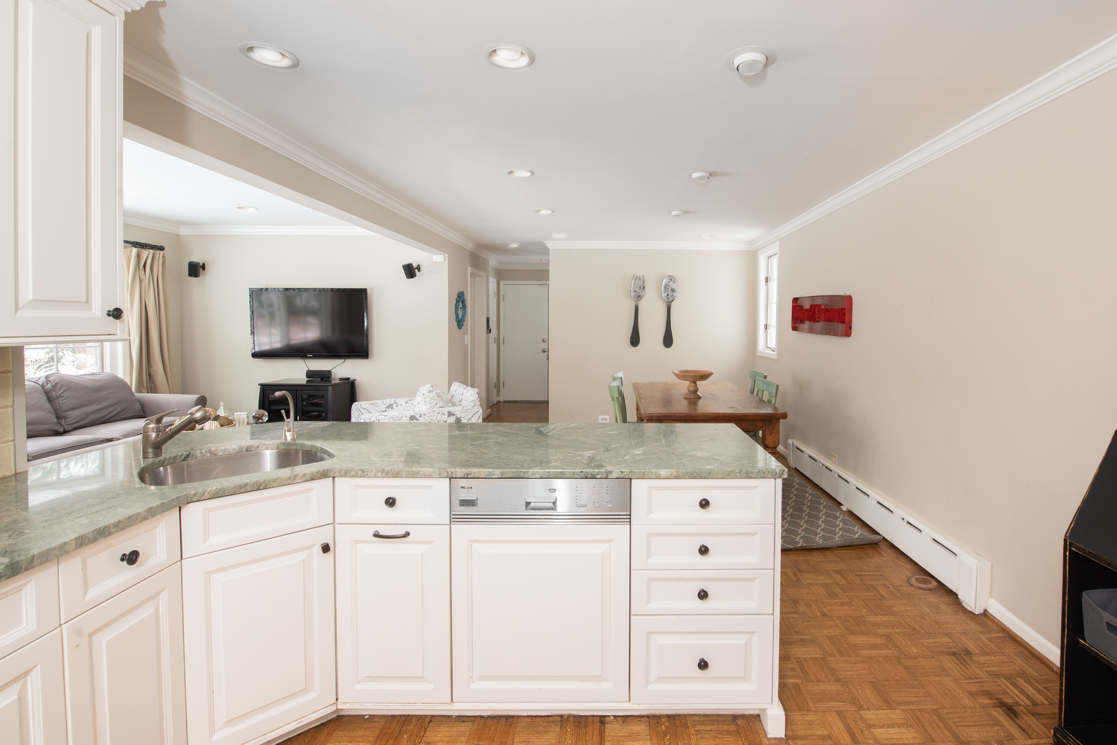 710 Walden Road Winnetka, IL 60093 - Photo 13 of 28 a kitchen with granite countertop white cabinets and white appliances