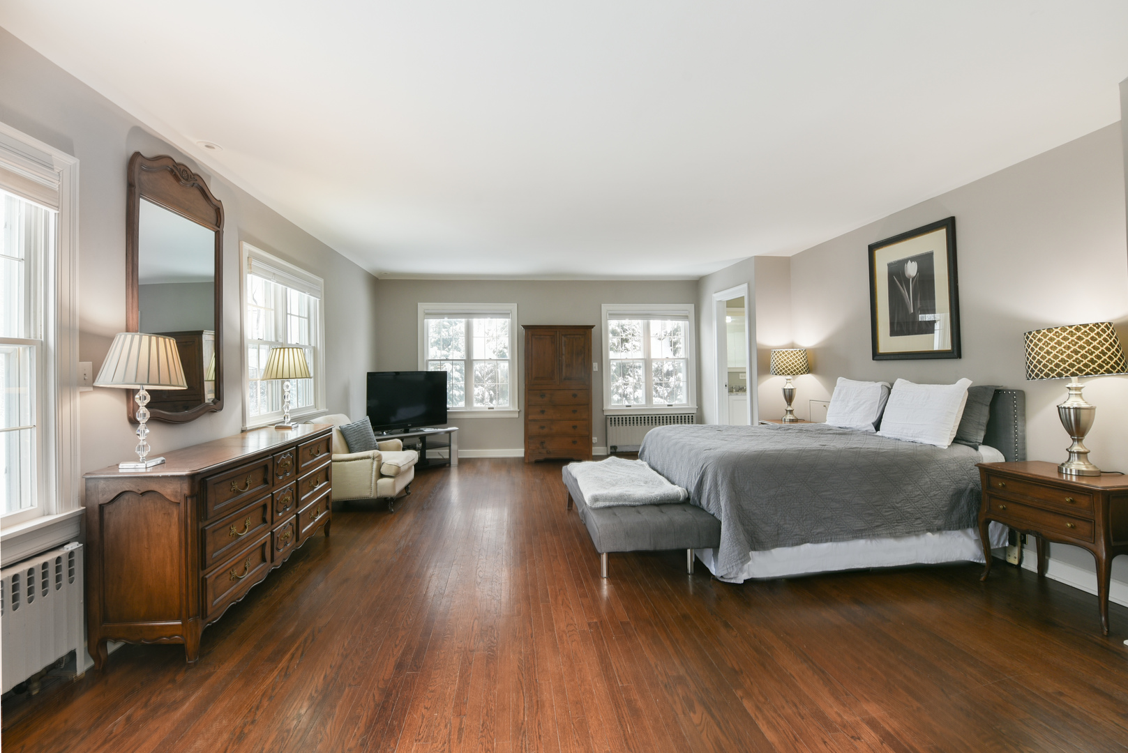 710 Walden Road Winnetka, IL 60093 - Photo 18 of 28 a bedroom with a bed couch and a view of kitchen