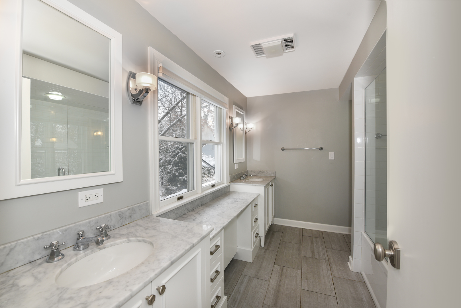 710 Walden Road Winnetka, IL 60093 - Photo 19 of 28 a bathroom with a granite countertop sink a mirror and a shower
