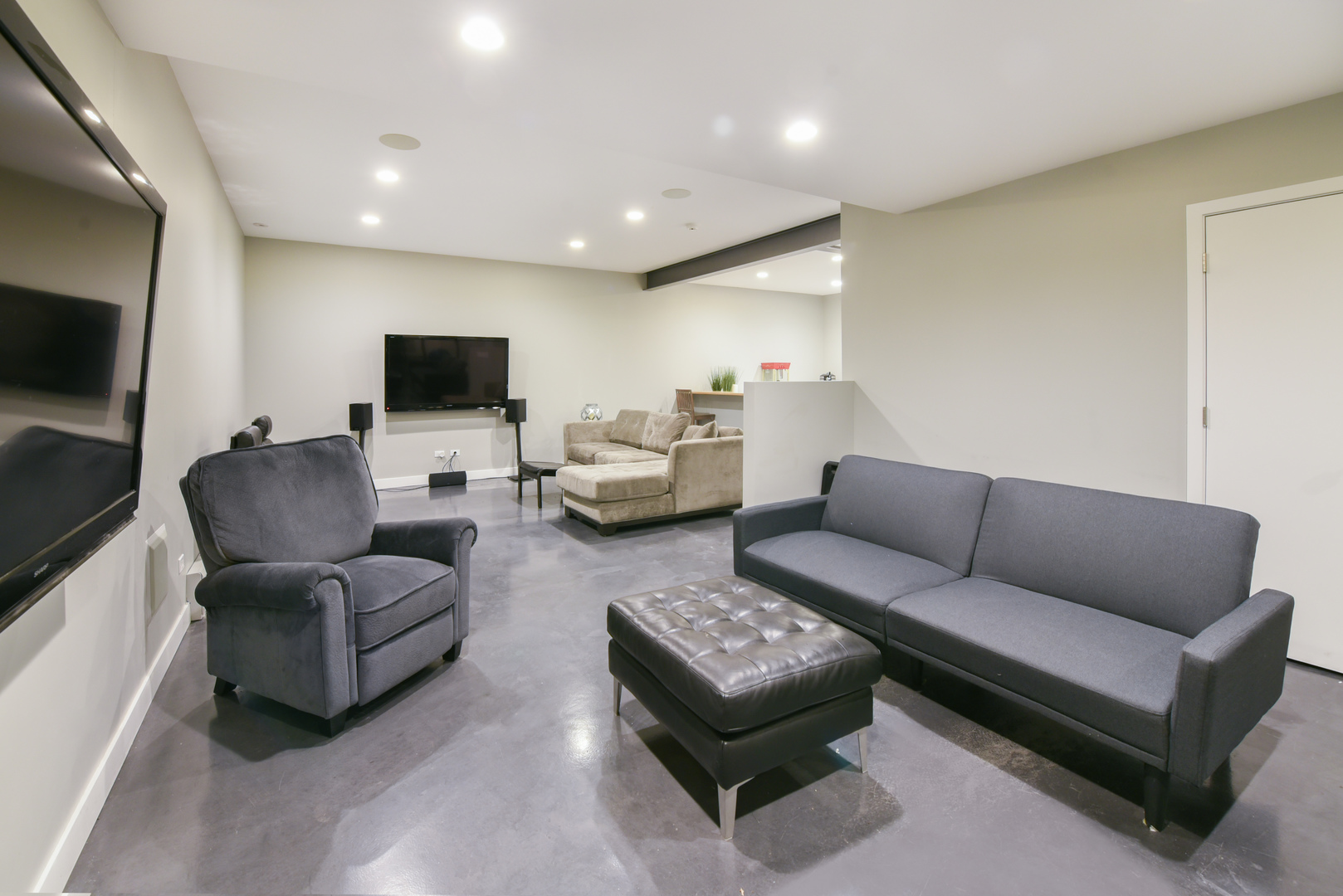 710 Walden Road Winnetka, IL 60093 - Photo 22 of 28 a living room with furniture and a flat screen tv
