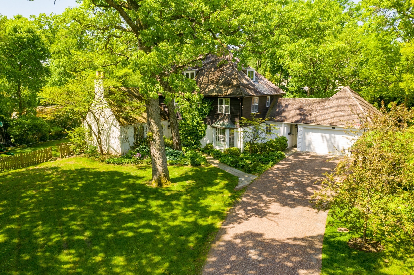 710 Walden Road Winnetka, IL 60093 - Photo 24 of 28 a backyard of a house with lots of green space and fountain