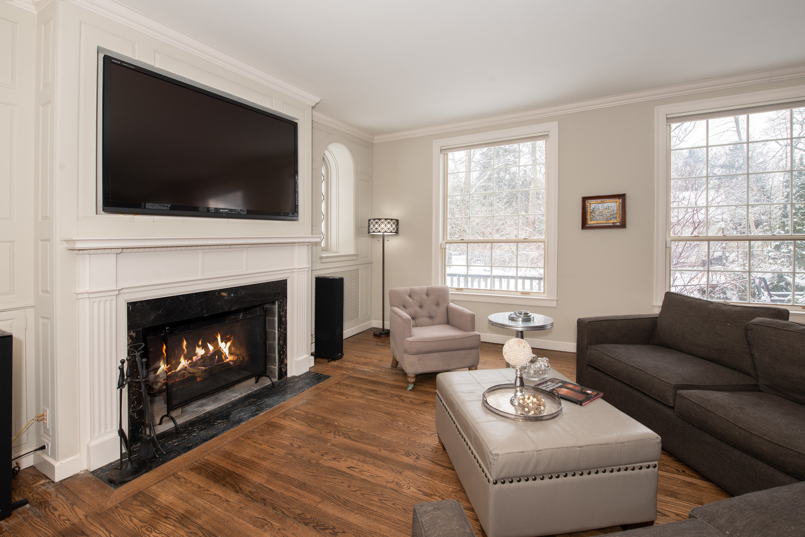 710 Walden Road Winnetka, IL 60093 - Photo 9 of 28 a living room with furniture a flat screen tv and a fireplace