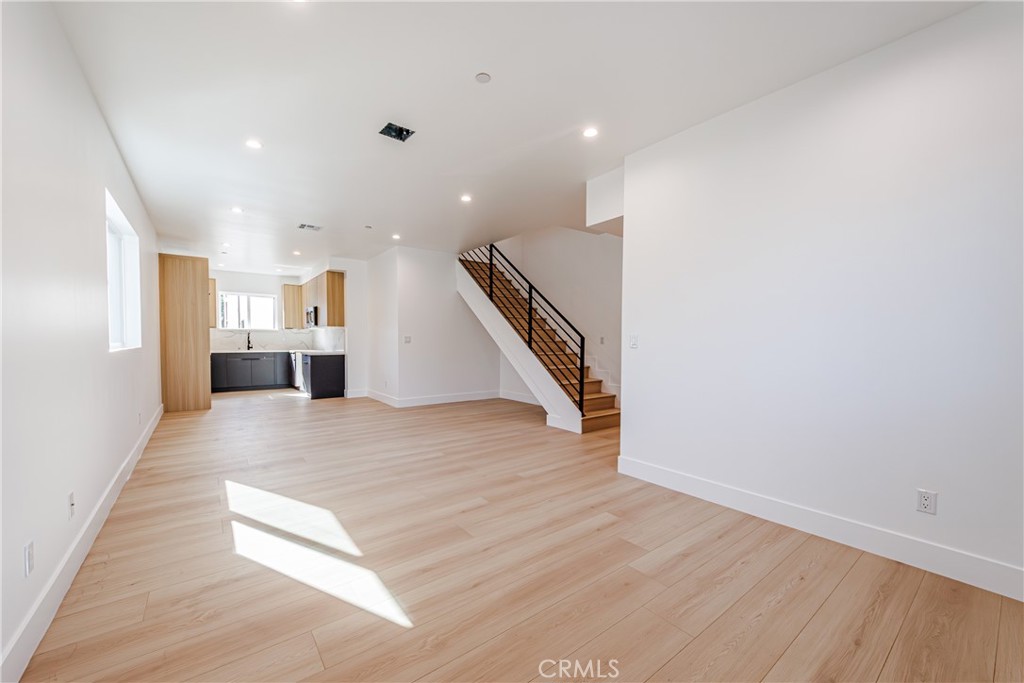 5209 20th Street, Unit A Los Angeles, CA 90016 - Photo 13 of 30 a view of kitchen and hall with wooden floor