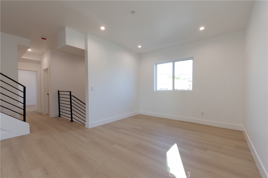 5209 20th Street, Unit A Los Angeles, CA 90016 - Photo 15 of 30 an empty room with windows and closet