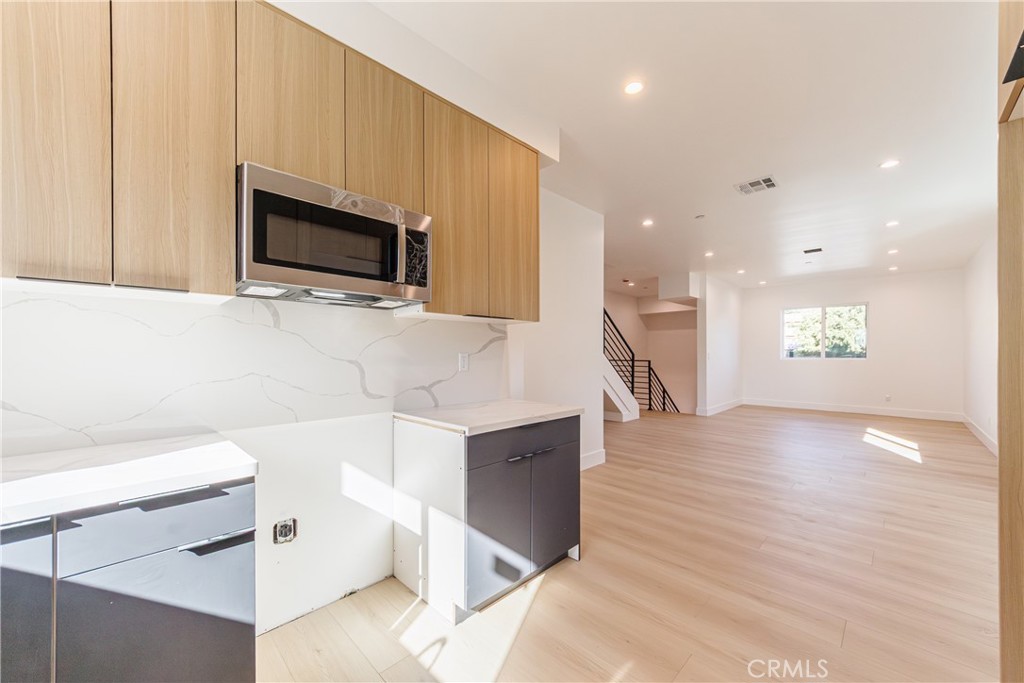 5209 20th Street, Unit A Los Angeles, CA 90016 - Photo 17 of 30 a view of a kitchen with microwave and cabinets
