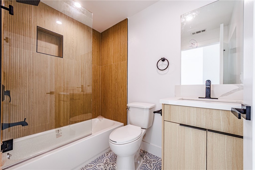 5209 20th Street, Unit A Los Angeles, CA 90016 - Photo 30 of 30 a bathroom with a sink a toilet and shower