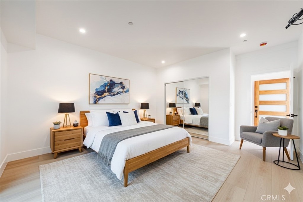 5209 20th Street, Unit A Los Angeles, CA 90016 - Photo 5 of 30 a spacious bedroom with a bed and a table