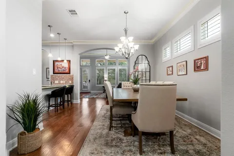 a kitchen with stainless steel appliances granite countertop a refrigerator a stove a sink and a oven