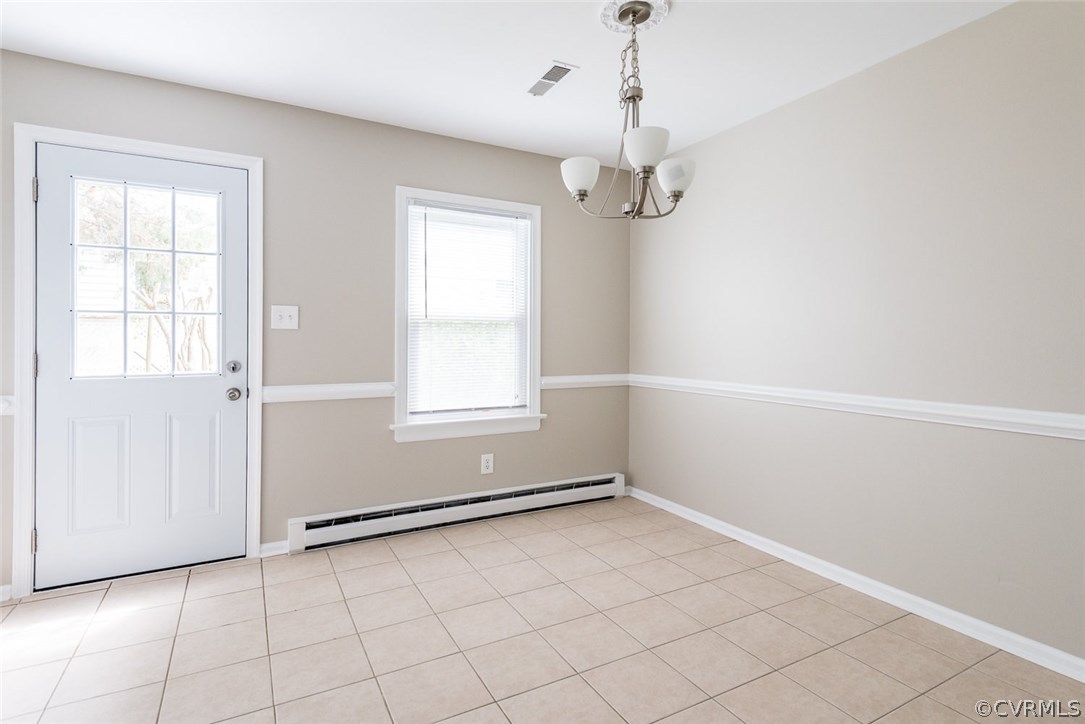 12112 Gardengate Road Midlothian, VA 23112 - Photo 8 of 20 an empty room with windows and chandelier fan