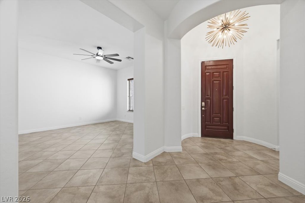 2125 De Rouge Avenue Henderson, NV 89044 - Photo 31 of 96 A spacious entry, with an elegant front door and arched entryway, welcomes you into this property.
