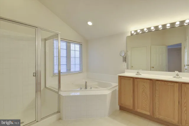 a bathroom with a bathtub and a sink