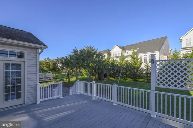 a view of a house with a backyard and swimming pool