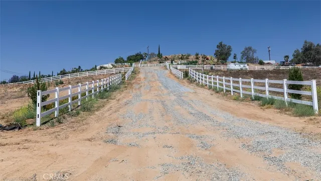 a view of a pathway with a ocean view