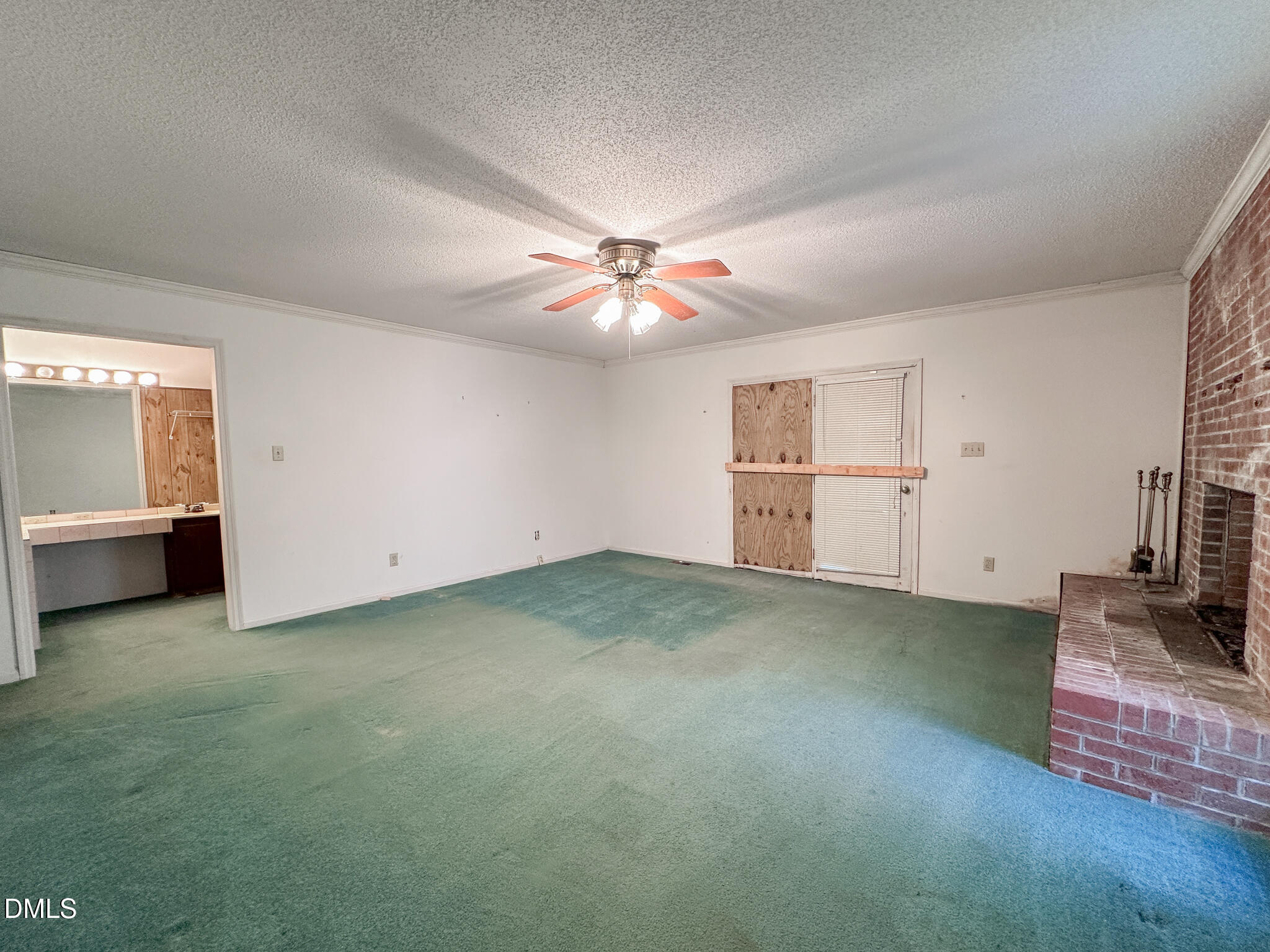 188 Jones Chapel Road Norlina, NC 27563 - Photo 44 of 71 an empty room with fireplace and windows