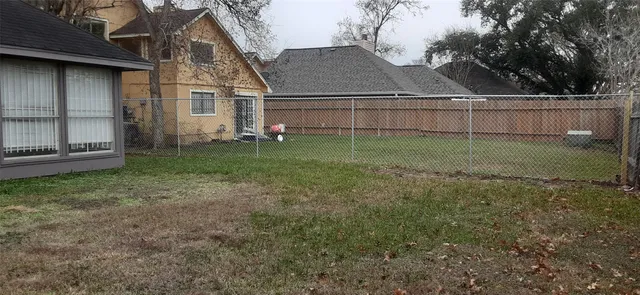 a view of backyard with green space