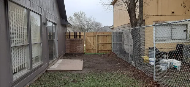 a view of a back yard of the house