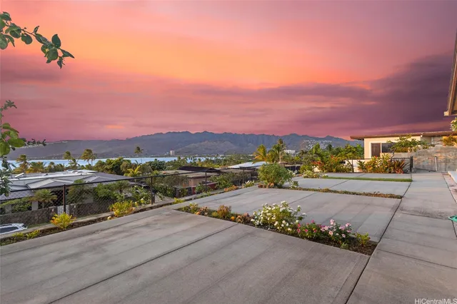 a view of a street with a building in the background