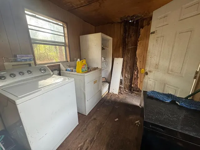 a utility room with dryer and washer