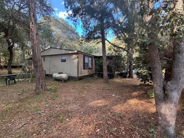 a house view with a backyard space