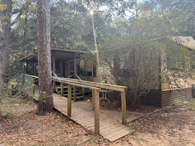 a view of a chairs and table in the patio
