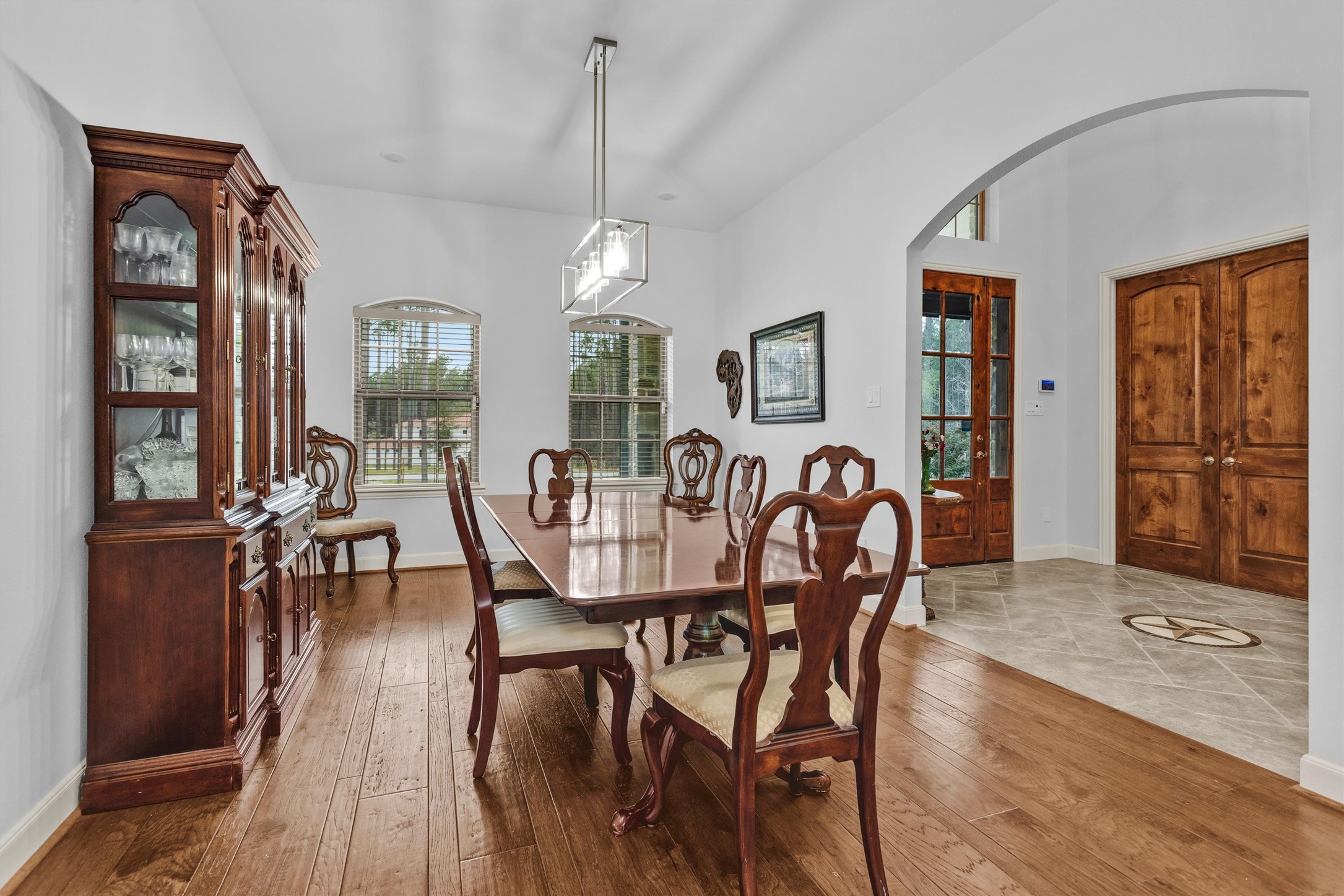 264 Grey Feather Road Huntsville, TX 77340 - Photo 12 of 31 a view of a dining room with furniture and wooden floor