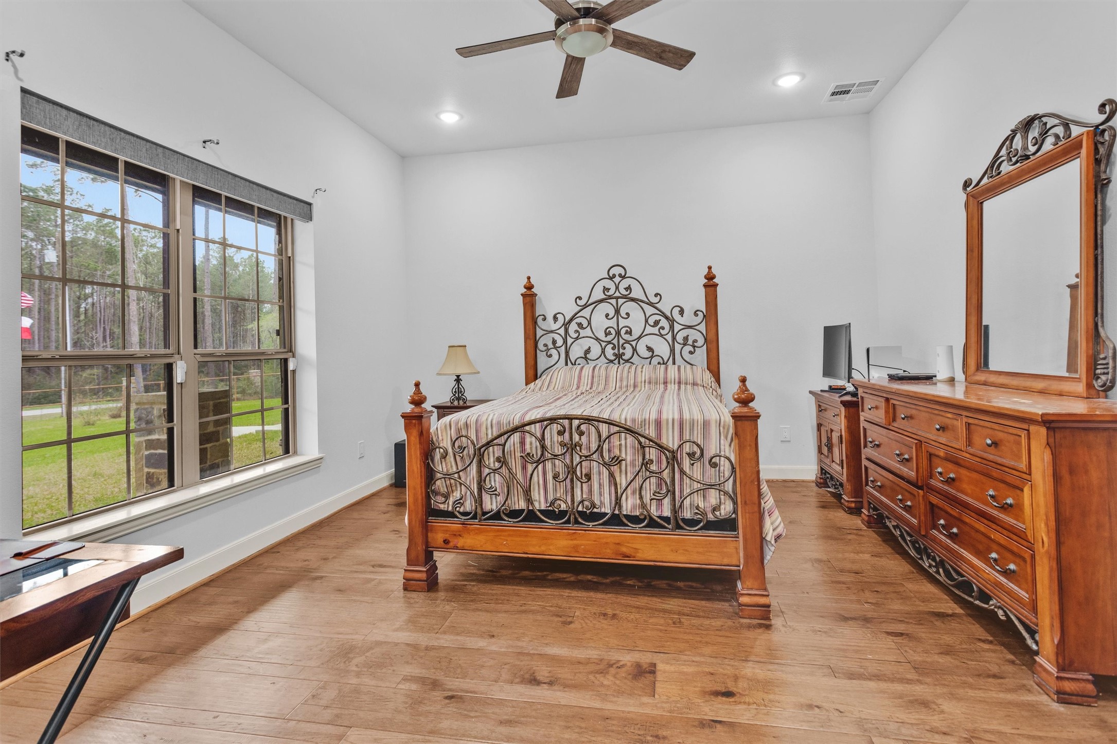 264 Grey Feather Road Huntsville, TX 77340 - Photo 19 of 31 a bedroom with furniture and a window