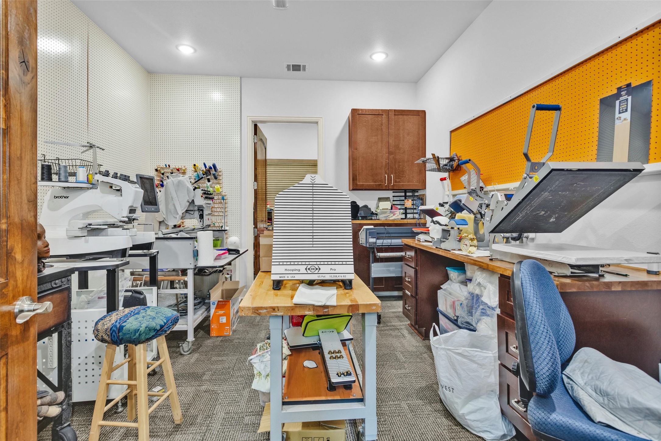 264 Grey Feather Road Huntsville, TX 77340 - Photo 24 of 31 a living room with chairs kitchen view and a large window