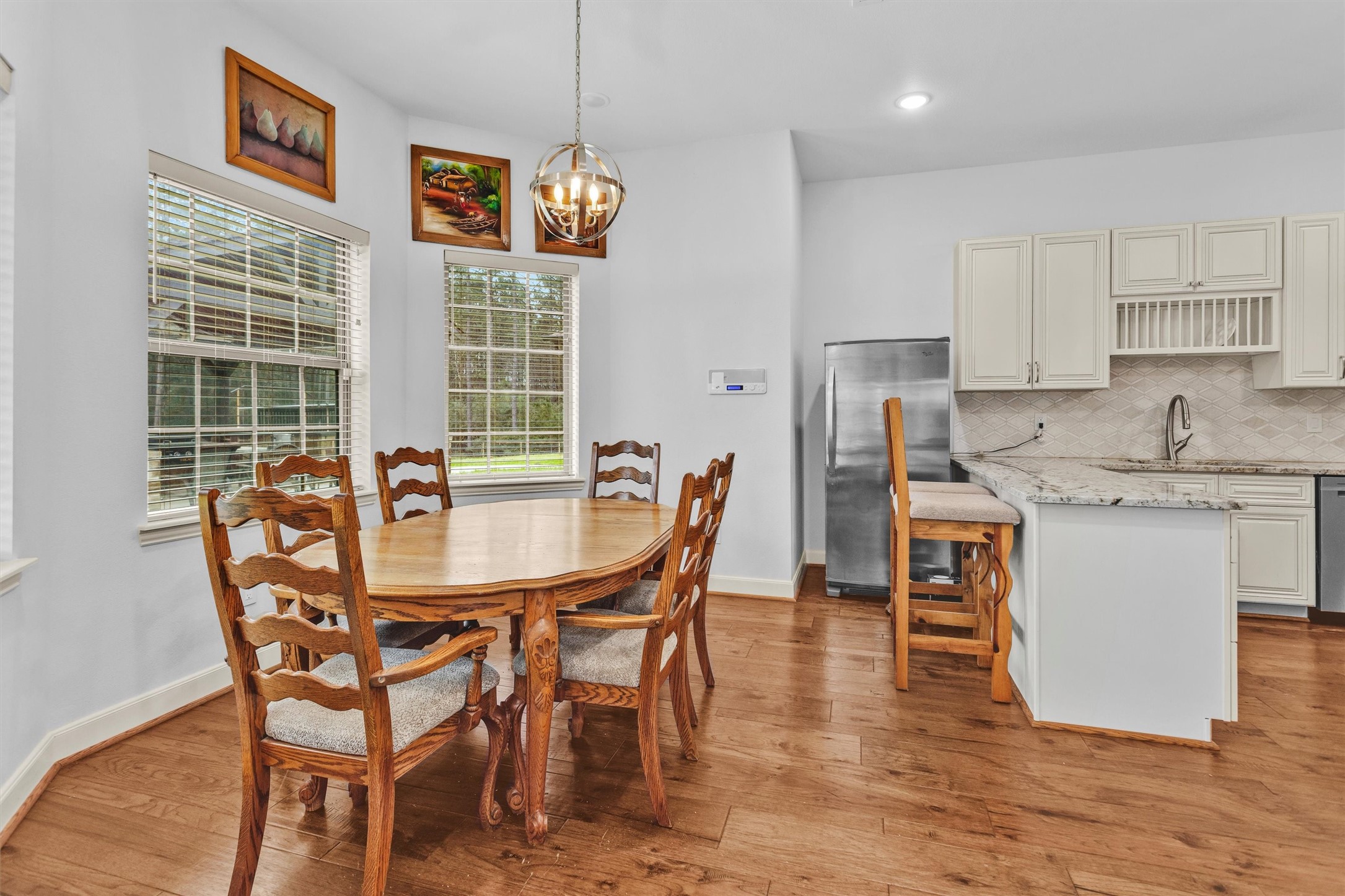 264 Grey Feather Road Huntsville, TX 77340 - Photo 9 of 31 a dining room with furniture and window