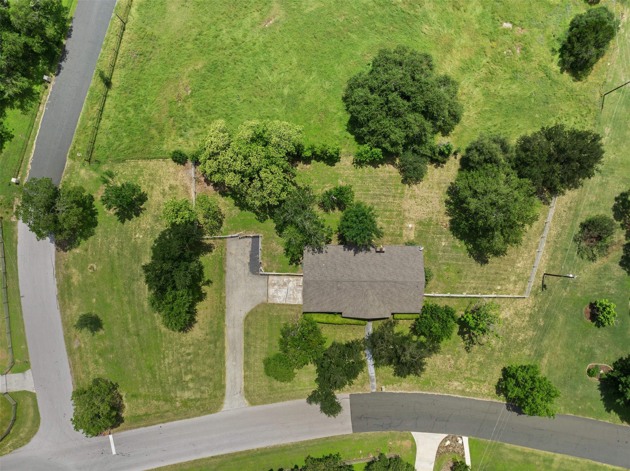 1600 Pin Oak Lane Round Rock, TX 78681 - Photo 40 of 40 Aerial perspective showcasing a single-story residence with a gabled roof