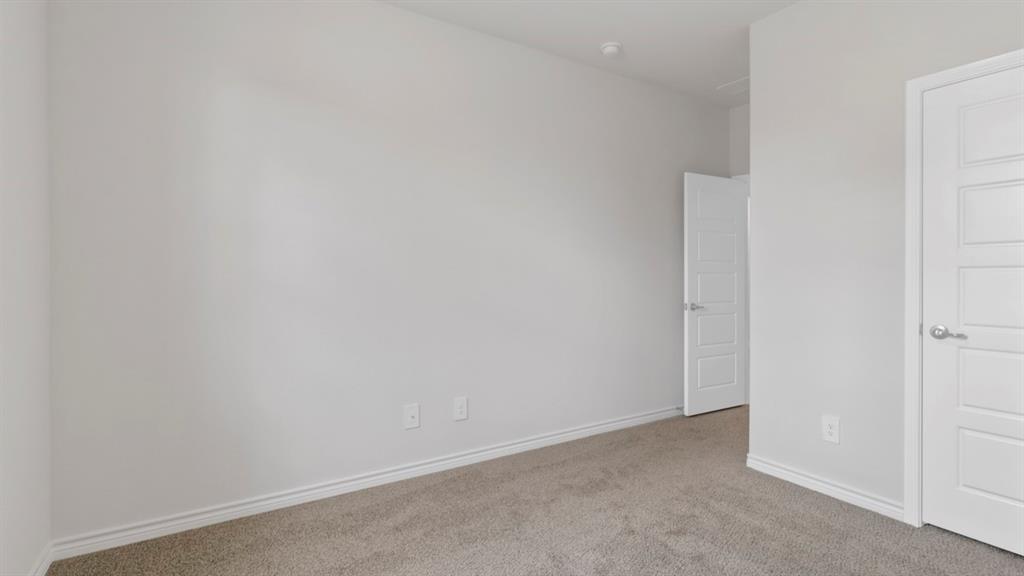 510 Range Road Caddo Mills, TX 75135 - Photo 11 of 25 Unfurnished bedroom with carpet and baseboards