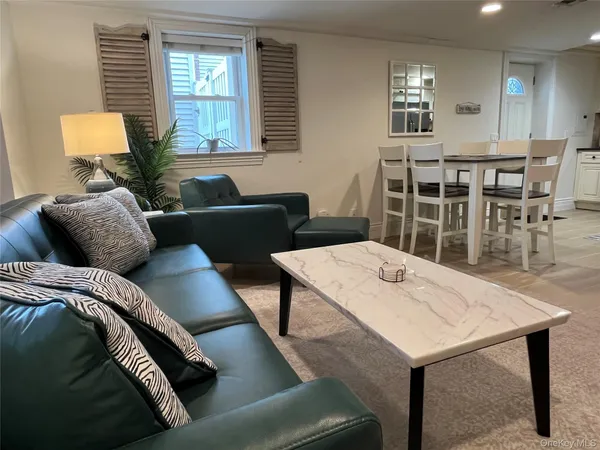 a view of a livingroom with furniture and window