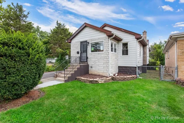 a view of a house with a yard and porch