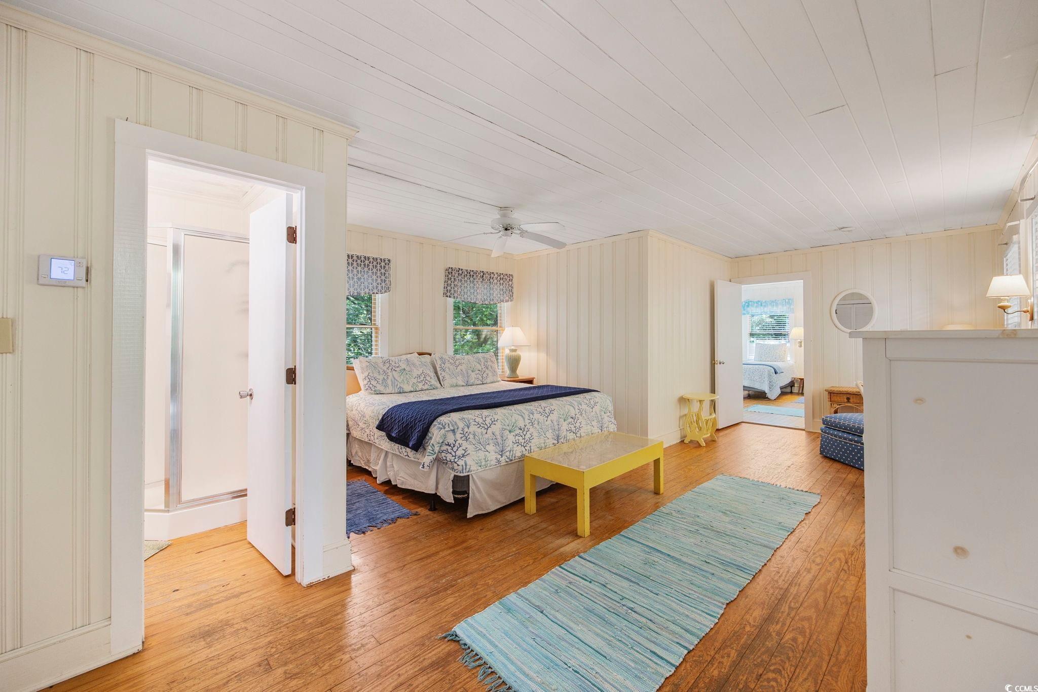 496 Myrtle Avenue Pawleys Island, SC 29585 - Photo 15 of 40 Bedroom featuring light wood-type flooring and ceiling fan