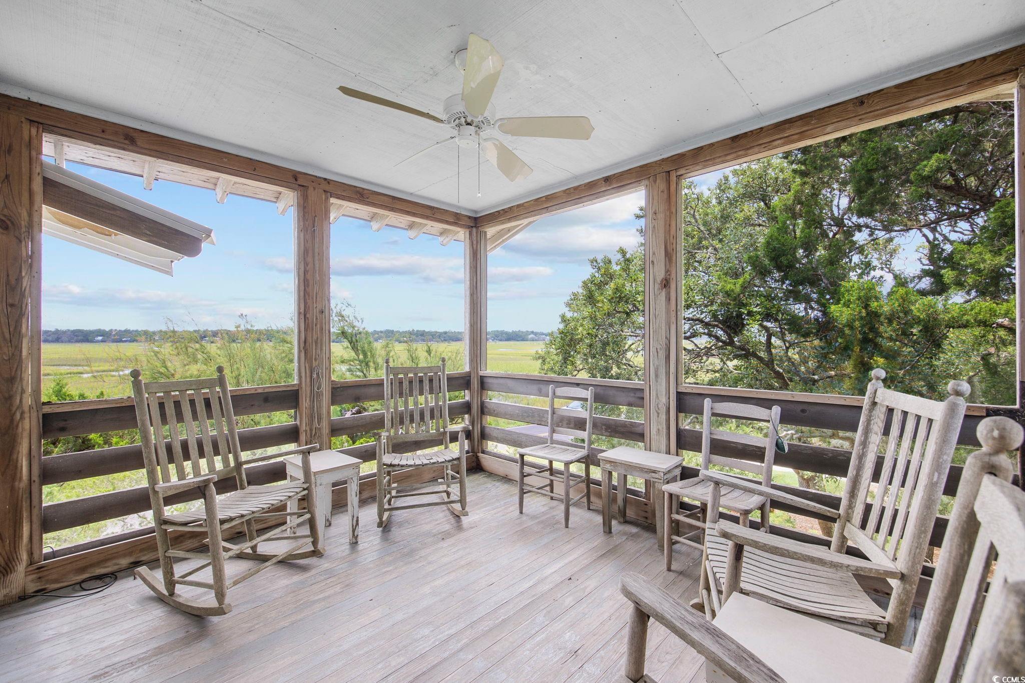 496 Myrtle Avenue Pawleys Island, SC 29585 - Photo 36 of 40 Sunroom / solarium featuring ceiling fan and a healthy amount of sunlight