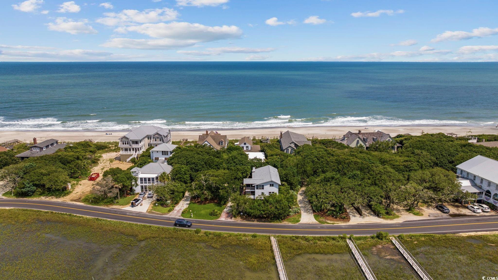 496 Myrtle Avenue Pawleys Island, SC 29585 - Photo 4 of 40 Bird's eye view featuring a water view and a view of the beach